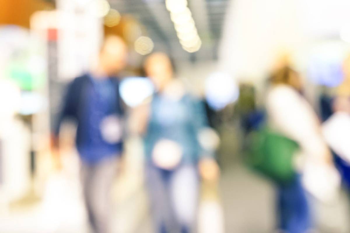 Two people visit a trade fair.